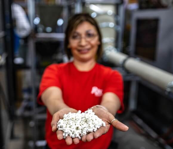 Woman holding plastic injection molds